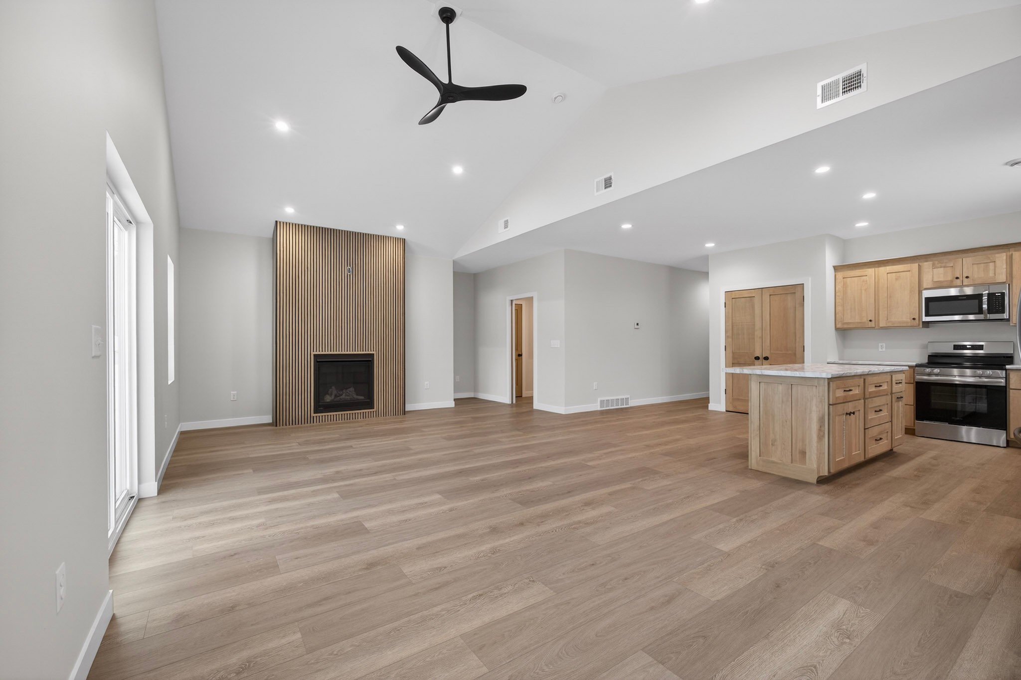 Open concept living with feature wall